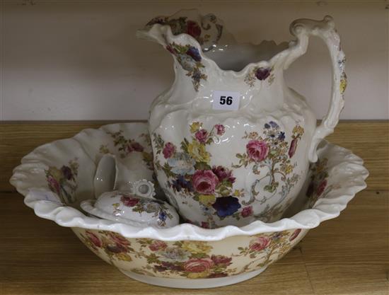 A Victorian four piece floral printed toilet set